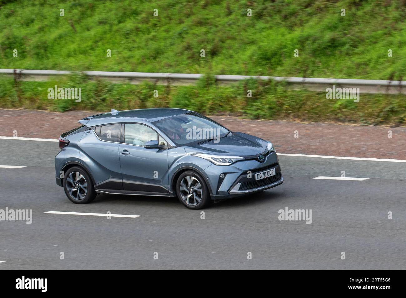 2020 Toyota C-Hr Design Hev Cvt 122 VVT-I Auto Start/Stop Grey Car SUV Hybrid Electric 1798 cc travelling at speed on the M6 motorway in Greater Manchester, UK Stock Photo
