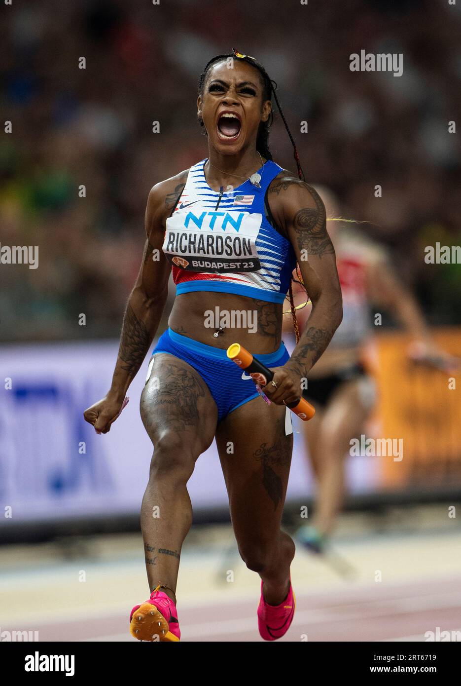 Sha'Carri Richardson of team USA competing in the 4x100m relay on day