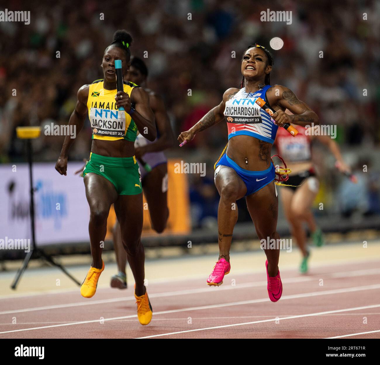 Sha'Carri Richardson of team USA competing in the 4x100m relay on day
