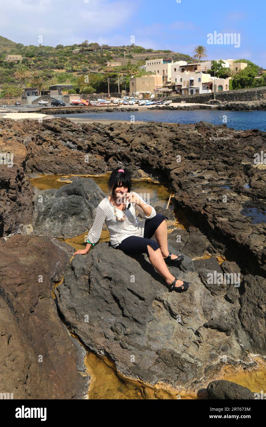 old woman in bikini on the rocks Stock Photo Alamy