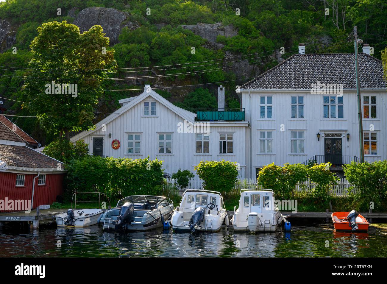 The Danish vice consulate building and moored boats in the well kept and charming seaside town of Kragero on the south coast. Telemark, Norway. Stock Photo