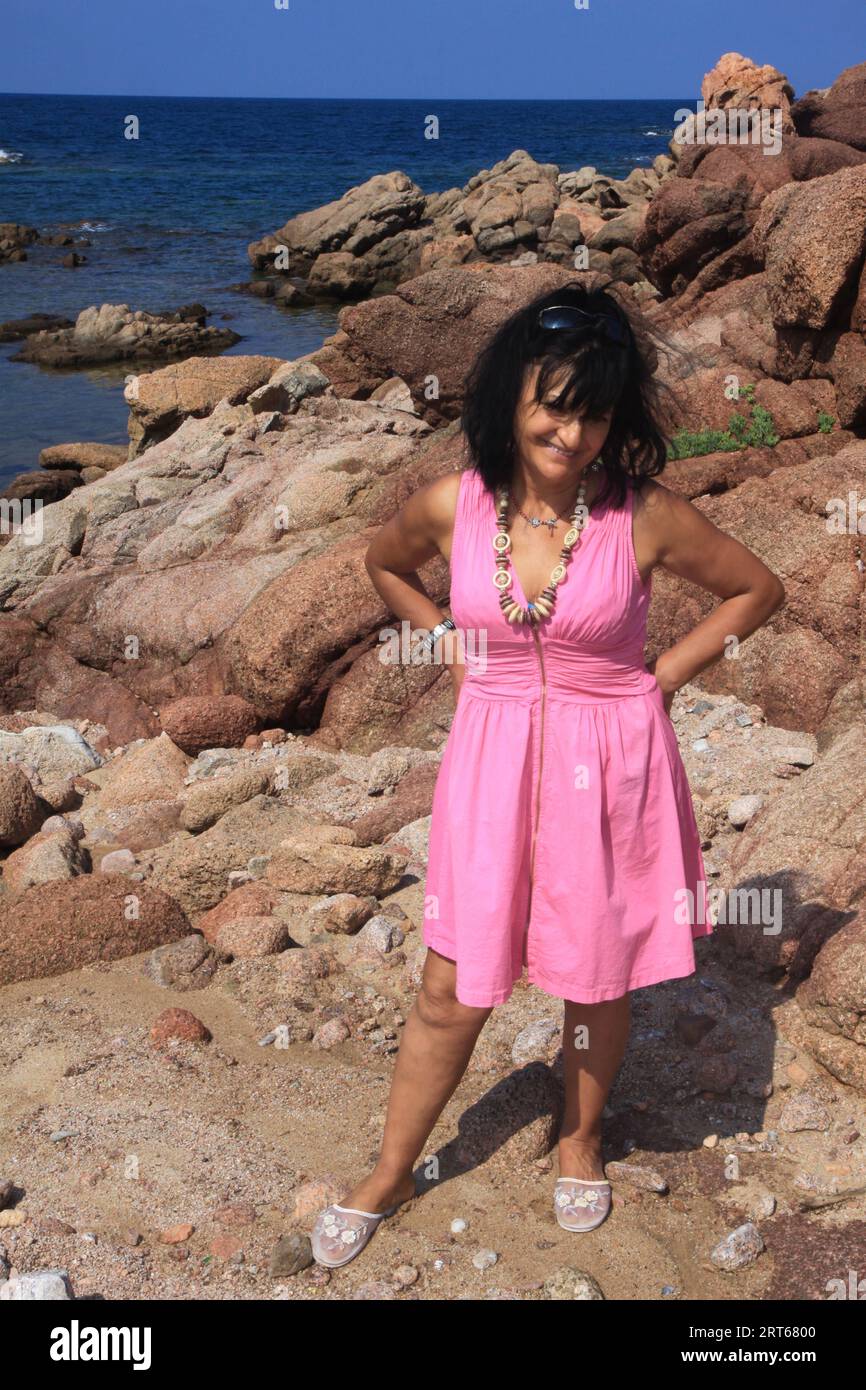 old woman in bikini on the rocks Stock Photo Alamy