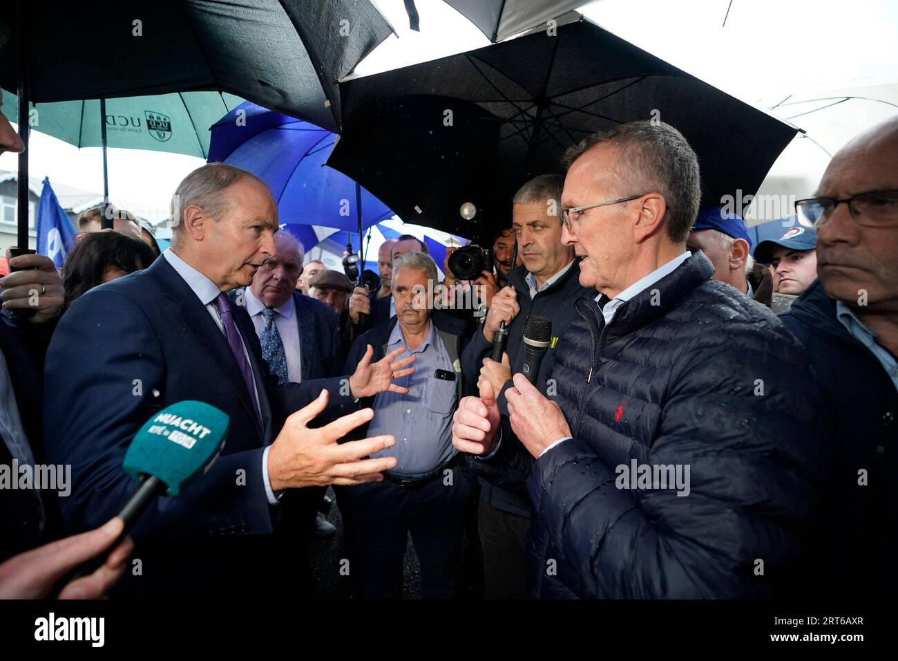 Tanaiste Micheal Martin (left) speaks to president of the Irish Farmers Association Tim Cullinan (right), outside the Horse and Jockey Hotel in Thurles, Co. Tipperary, as he arrives for an Fianna Fail party event. Picture date: Monday September 11, 2023. Stock Photo