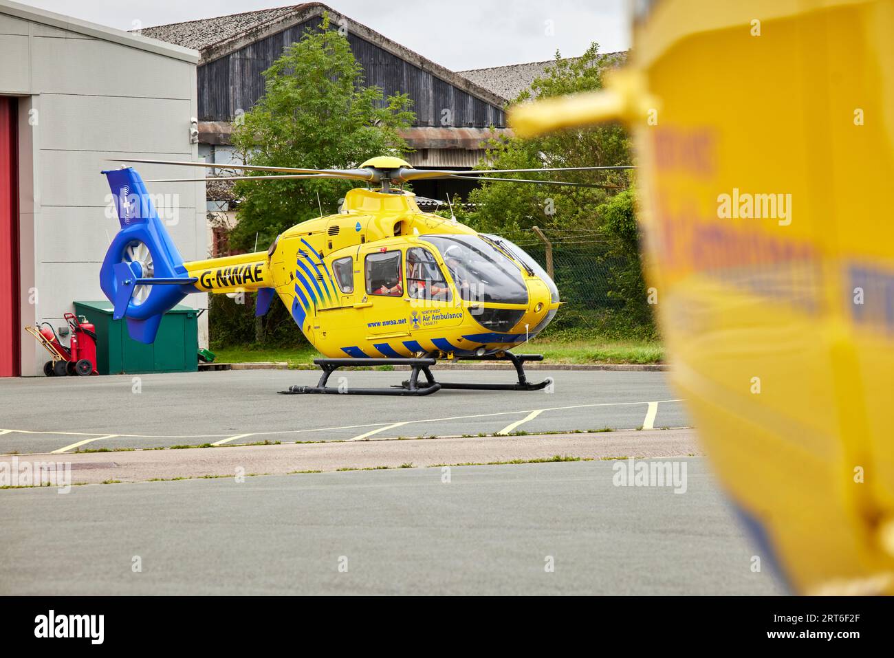 NorthWest Air Ambulance helicopters at Barton heli pad in Gtr Manchester Stock Photo
