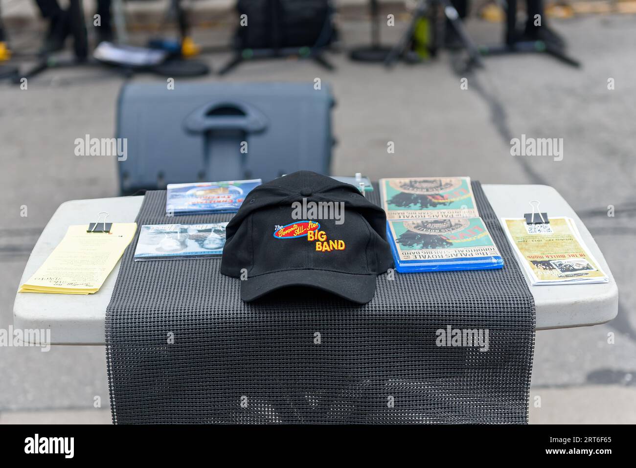 Toronto, Canada, Promotional items on a table while the Toronto All Stars Big Band performs live in the Cabbage Town traditional festival. Stock Photo