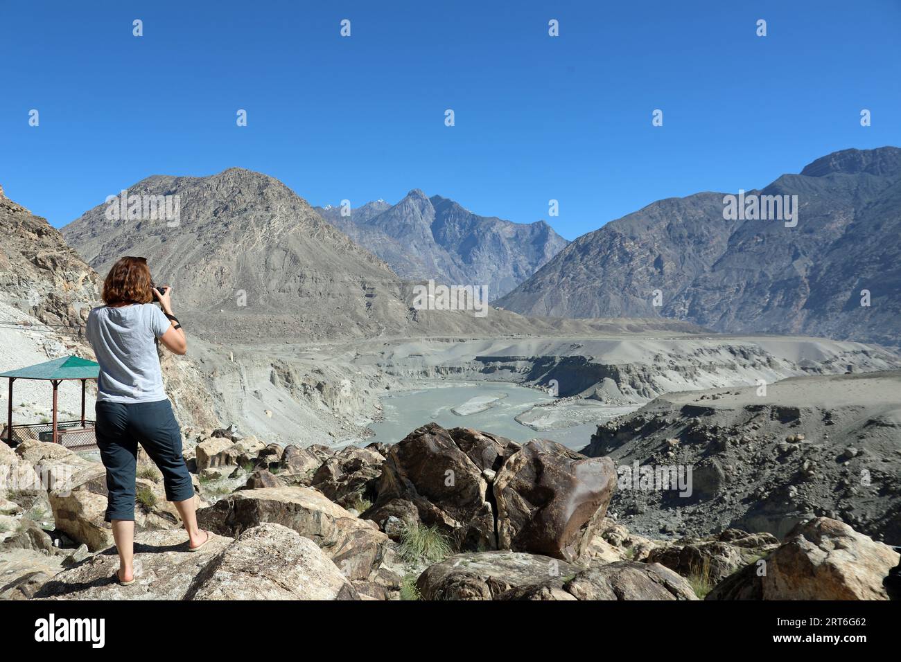 Tourist at the viewpoint for three mountain ranges in northern Pakistan