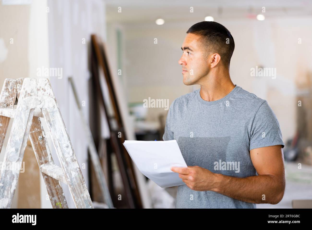 Architect making notes for space planning Stock Photo