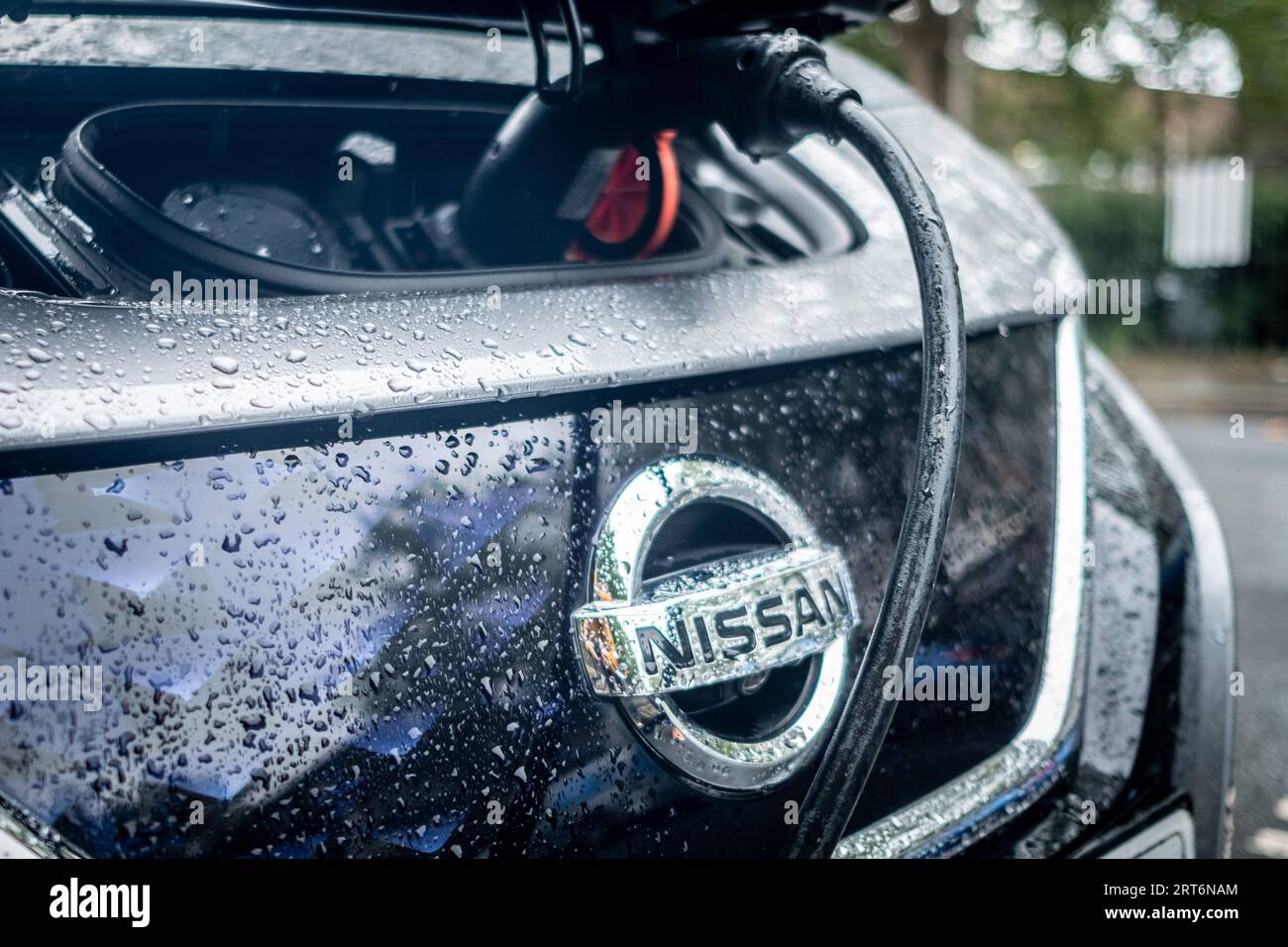 LONDON- AUGUST 8, 2023: Nissan electric car on charge on west London street Stock Photo