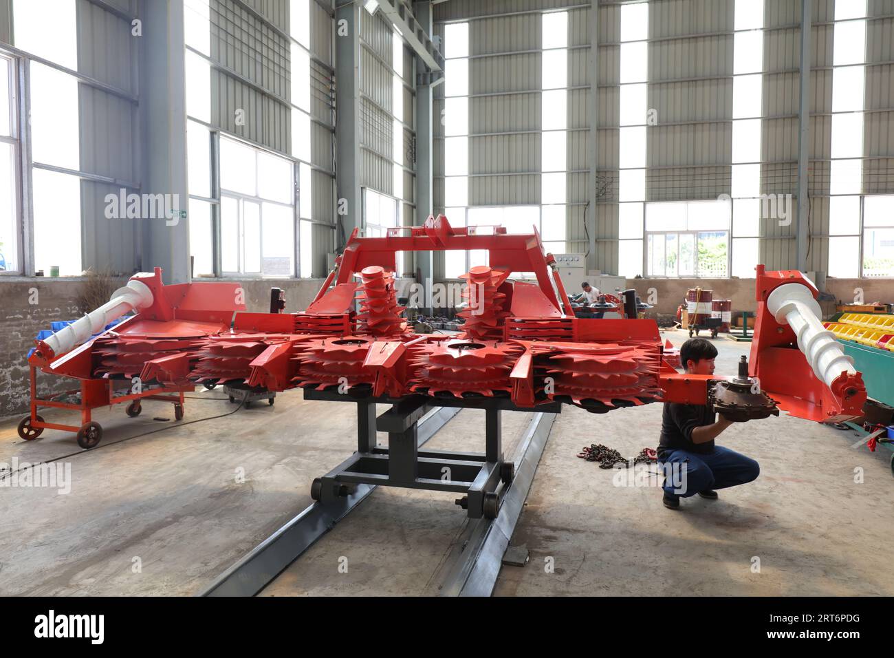 Luannan County, China - August 28, 2017: Agricultural machinery manufacturing workshop in a factory, Luannan County, Hebei Province, China Stock Photo