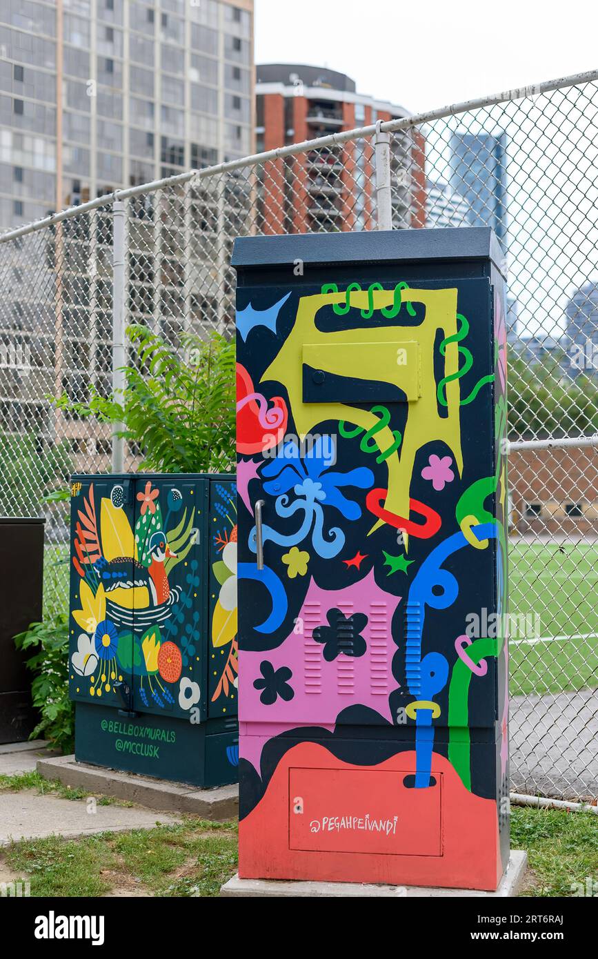 Toronto, Canada, Urban art painting in a stoplight box. The city allows local artists to decorate the structures and promote their work. Stock Photo