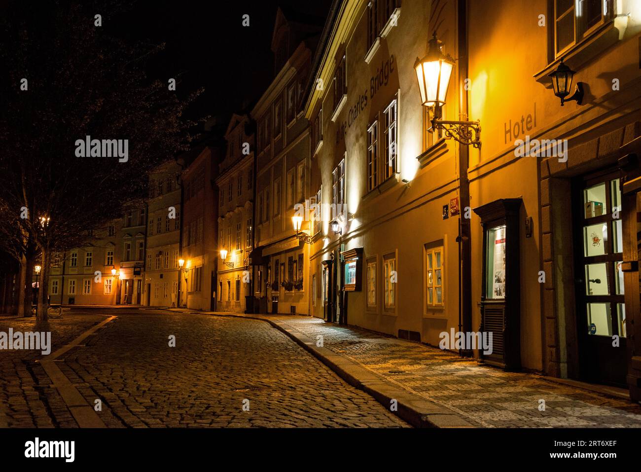 Tree lined cobblestoned Na Kampe Square, near the Charles Bridge, Kampa Island, Prague, Czech Republic. Stock Photo
