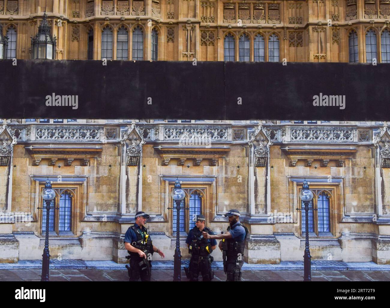 Armed police patrol outside the houses of parliament in london hi-res ...