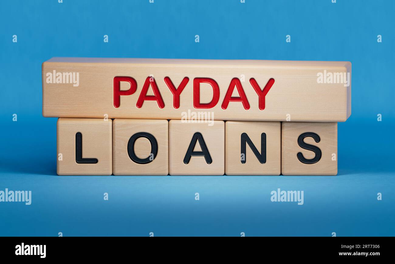 Payday loans symbol. Concept words Payday loans on beautiful books.  Business and Payday loans concept. Copy space.3D rendering on blue background. Wo Stock Photo