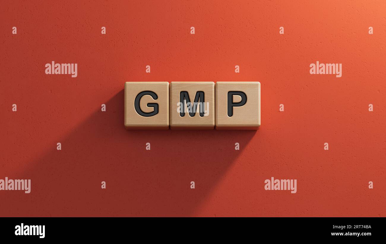 GMP - text on wooden cubes.3D rendering on red background. Stock Photo