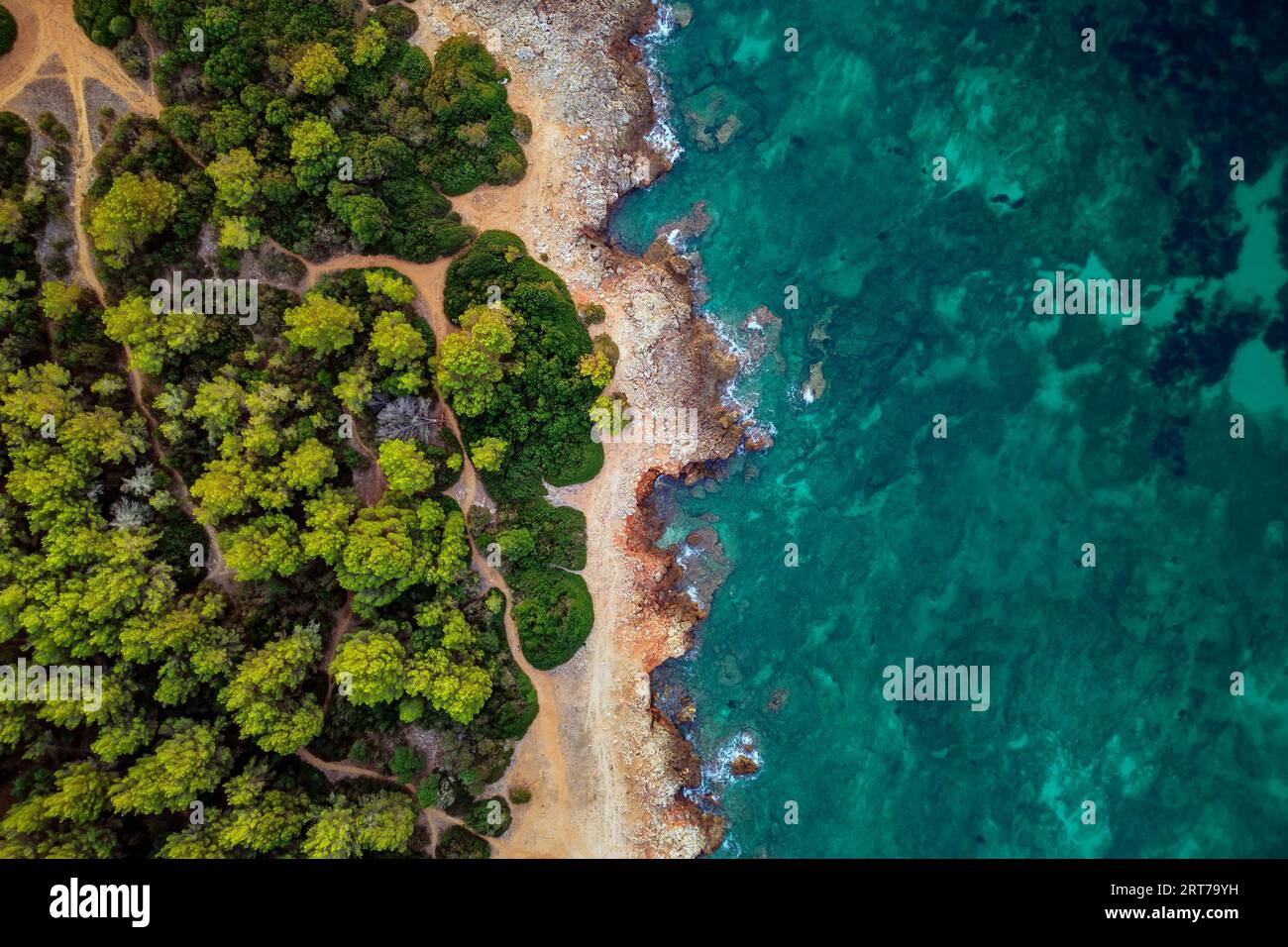 Rocky jagged shoreline and blue turquoise sea seen form drone during sunny day aerial photography Sa Coma Mallorca Spain Stock Photo