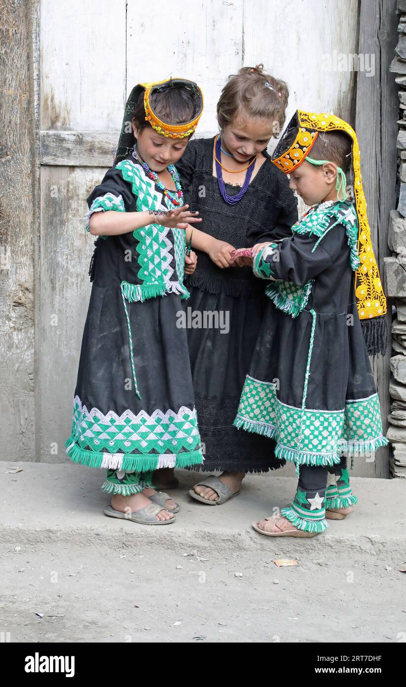 Kalasha girls with henna painted hands for the Uchaw summer festival Stock Photo