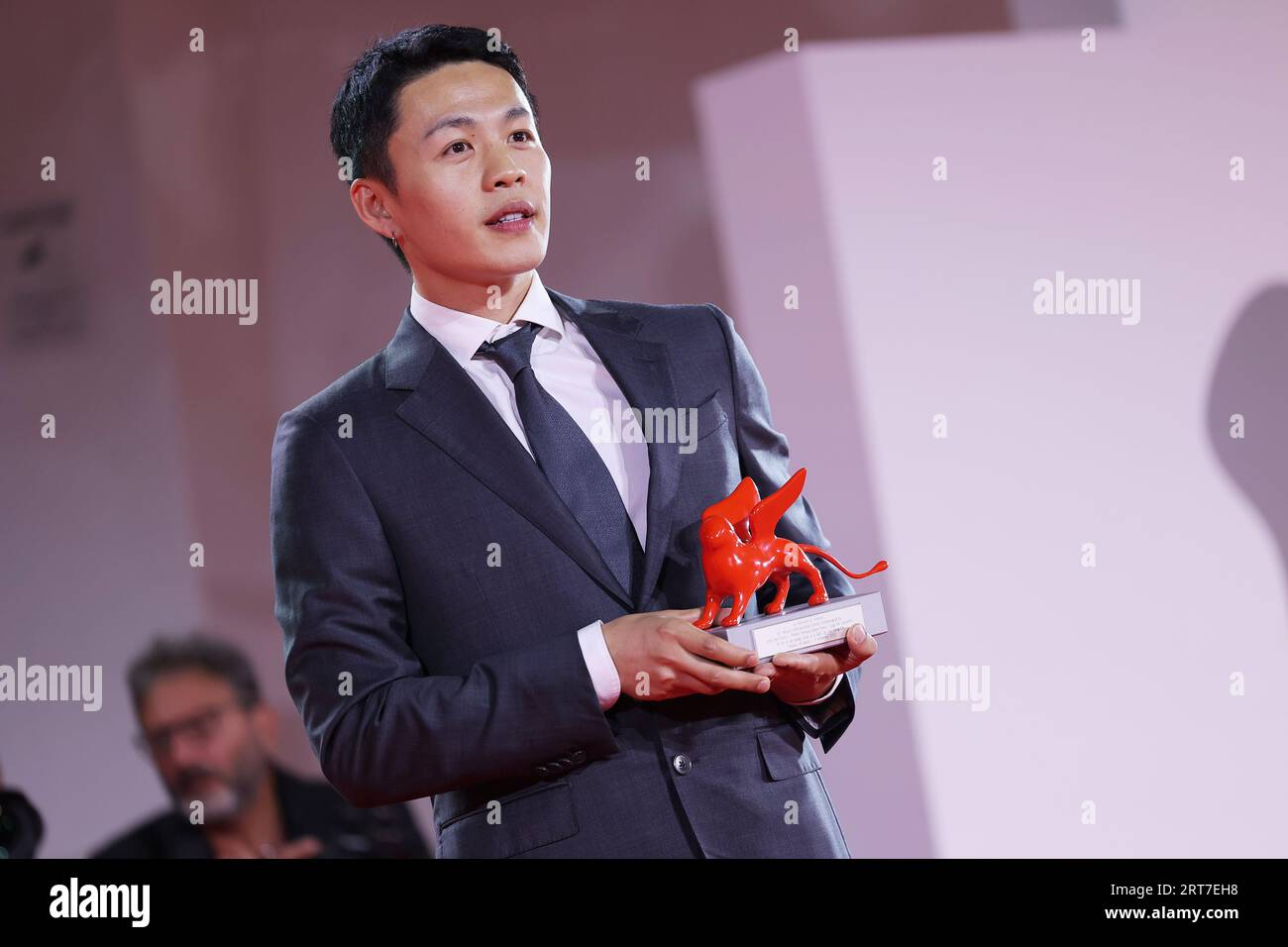 VENICE, ITALY - Sep 09: Lee Hong-Chi poses with the Lion of the Future - Luigi De Laurentiis Award for a Debut Film for film 'Love Is A Gun' at the winner's photocall at the 80th Venice International Film Festival on September 09, 2023 in Venice, Italy.  (Photo by Mark Cape/Insidefoto) Stock Photo