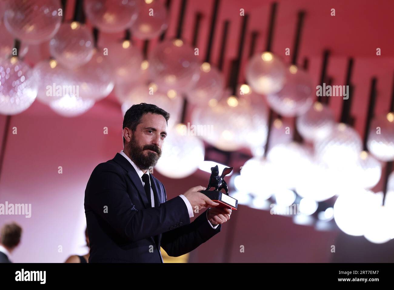 VENICE, ITALY - Sep 09: Pablo Larrain poses with the Best Screenplay Award for film 'El Conde' at the winner's photocall at the 80th Venice International Film Festival on September 09, 2023 in Venice, Italy. (Photo by Mark Cape/Insidefoto) Stock Photo