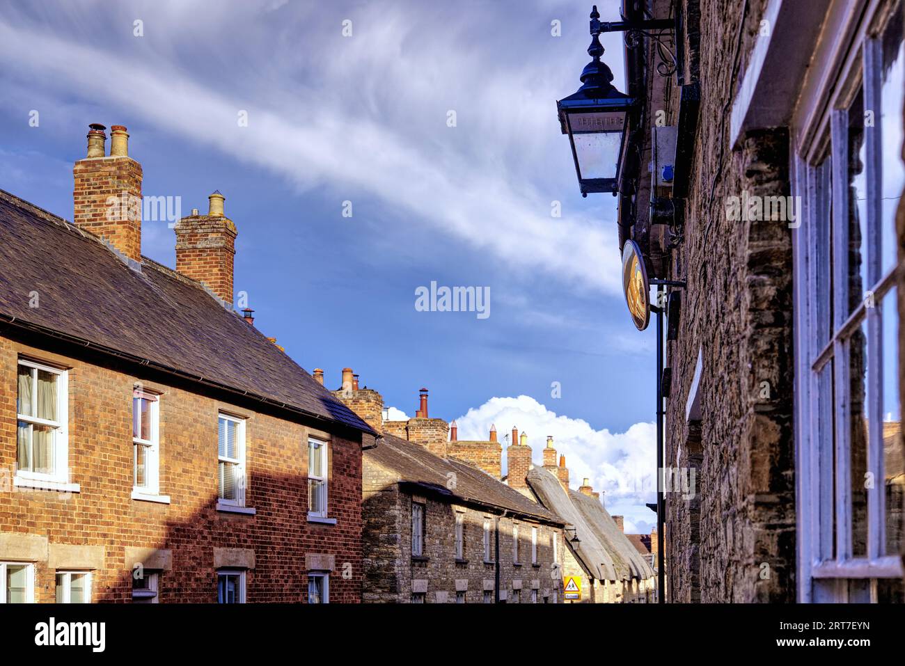 Sharnbrook, Bedfordshire, England, UK - Stone built cottages in the village high street Stock Photo