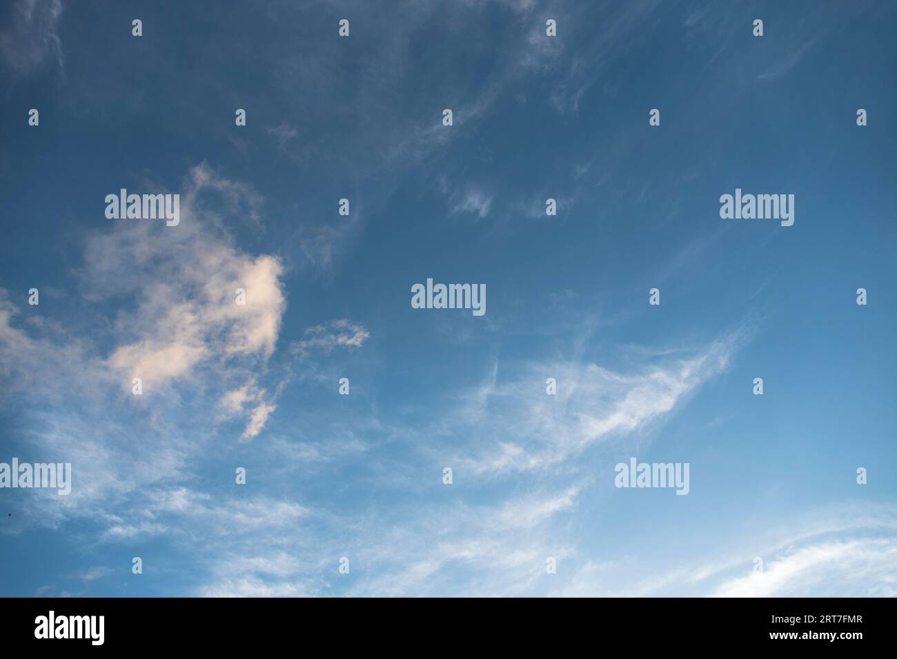 Bright sky in daylight with floating clouds. Stock Photo