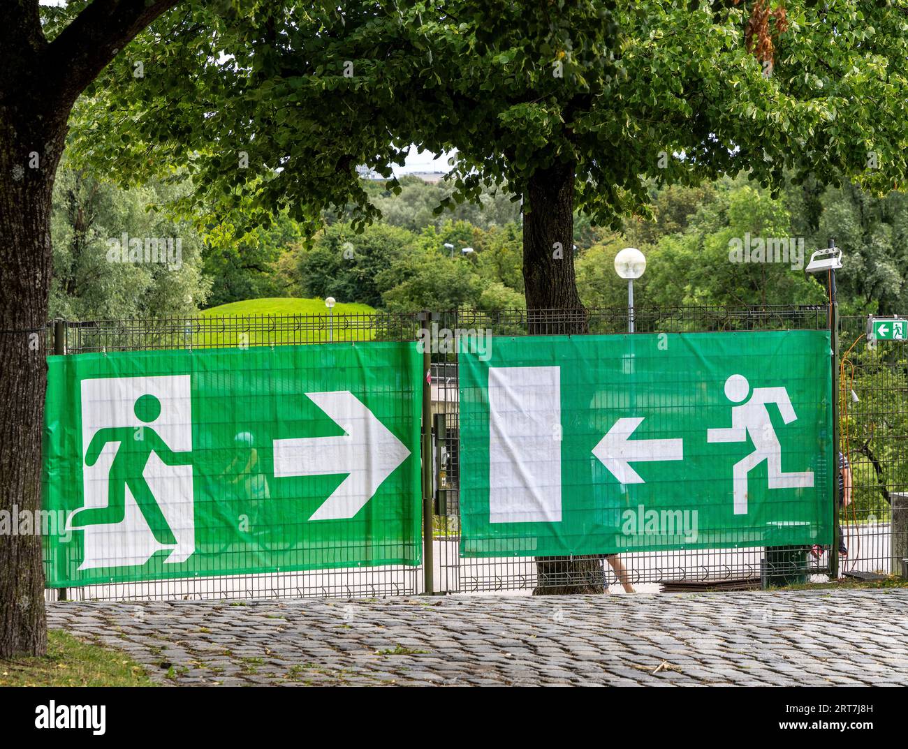 Construction Fence With Sign For Escape Route, Munich, Bavaria, Germany Stock Photo