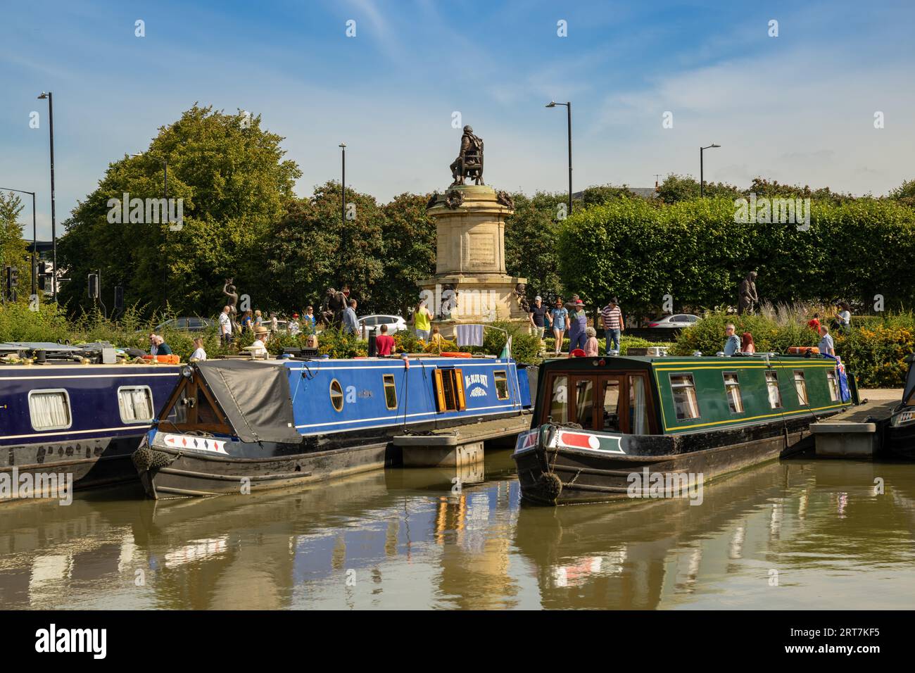 Canal boats in Bancroft Basin with the Shakespeare Memorial in the background, Stratford on Avon,Warwickshire, England Stock Photo