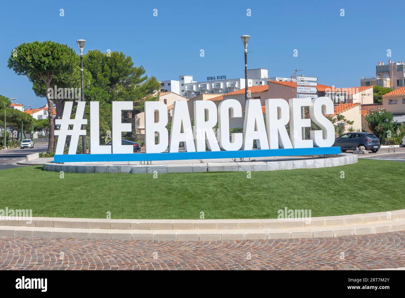 A large Le Barcares sign on a roundabout in Le Barcares Stock Photo