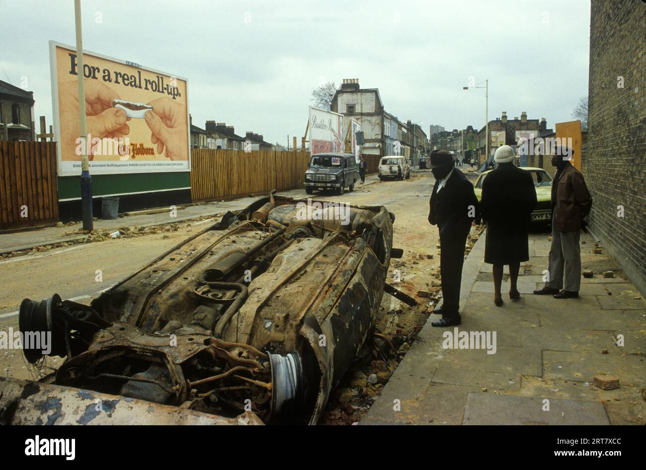 Brixton Riots 1981 UK.  The day after local local people looking at damage caused to their neighbourhood. Brixton South London Uk April 1980s England HOMER SYKES. Stock Photo