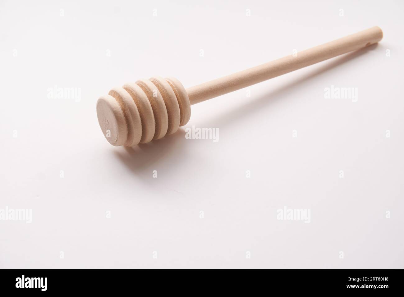 Wooden Honey Dipper isolated on a white background Stock Photo