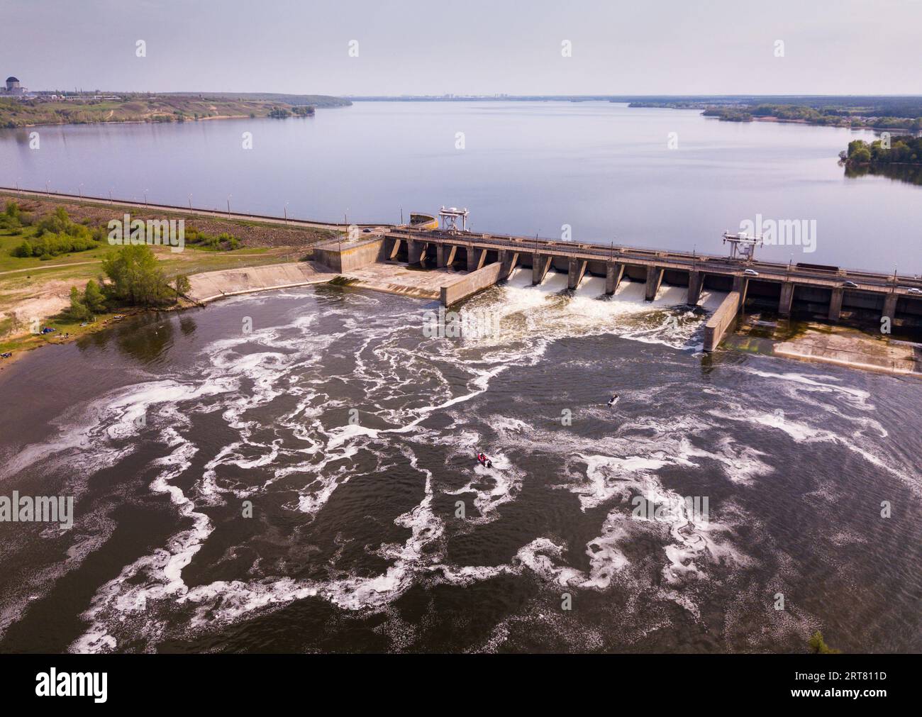 View of river with dam construction Stock Photo - Alamy