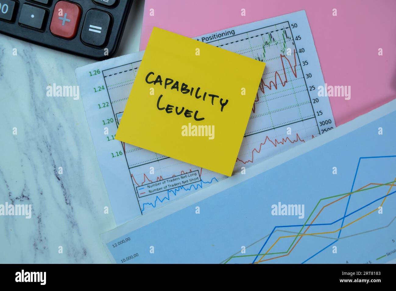 Concept of Capability Level write on sticky notes isolated on Wooden Table. Stock Photo