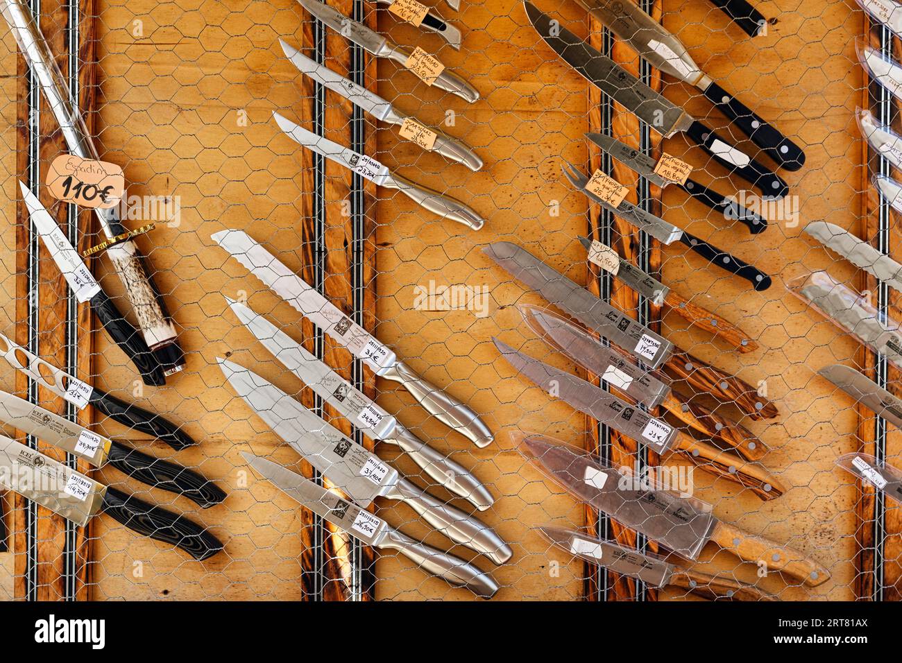 Traditional Portuguese knives in front of a souvenir shop, different