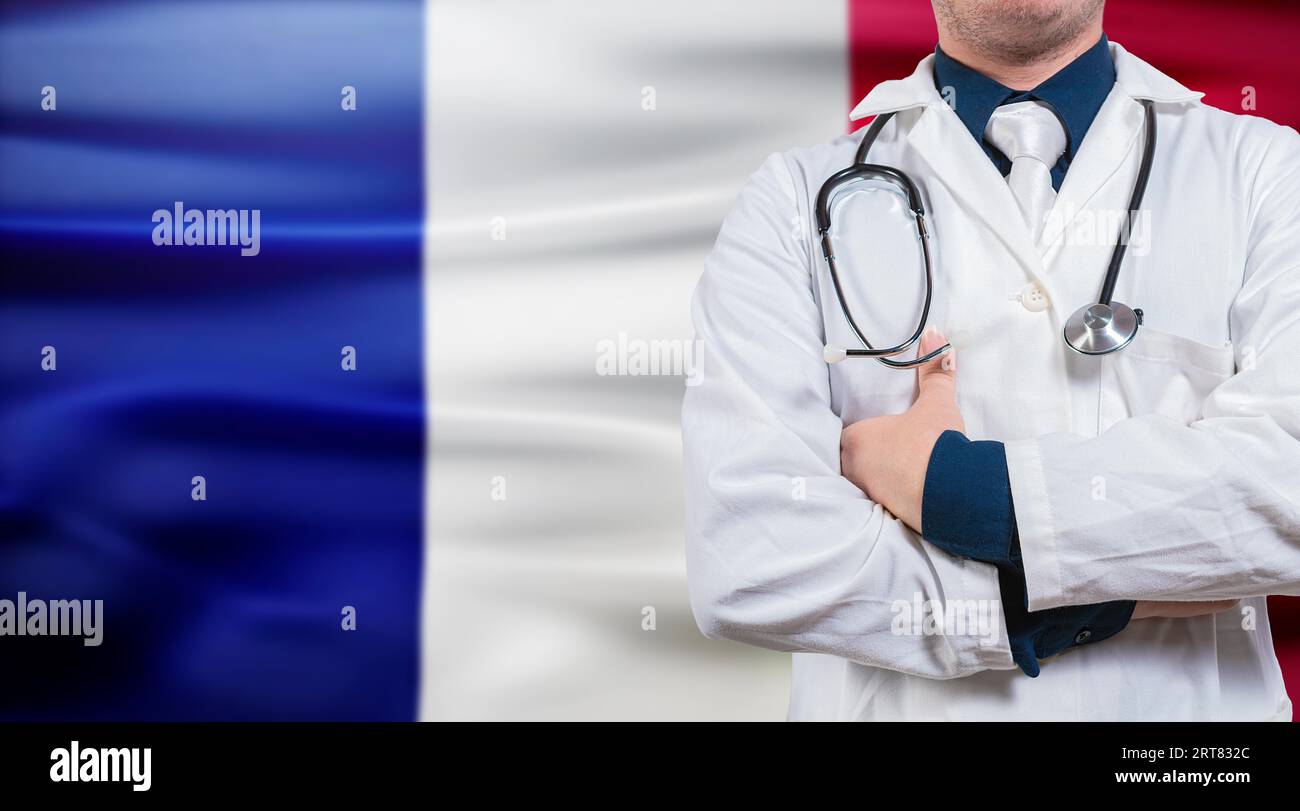 Doctor with stethoscope on France flag. Doctor with arms crossed on