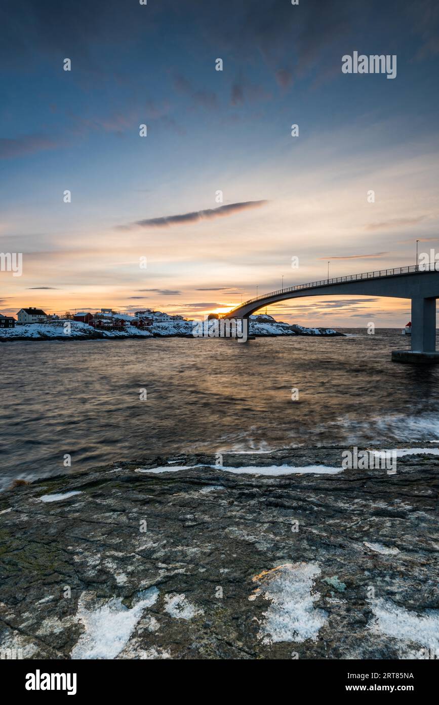 The famous photospot on the bridge for photgraphing the iconic red stilt houses on the coast in the village Hamnoy on the Lofoten islands in Norway Stock Photo