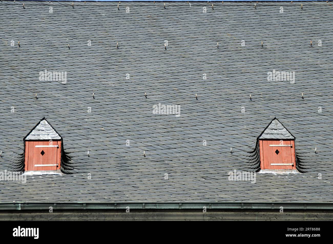 Roof hatch in the pointed roof made of slate Stock Photo Alamy