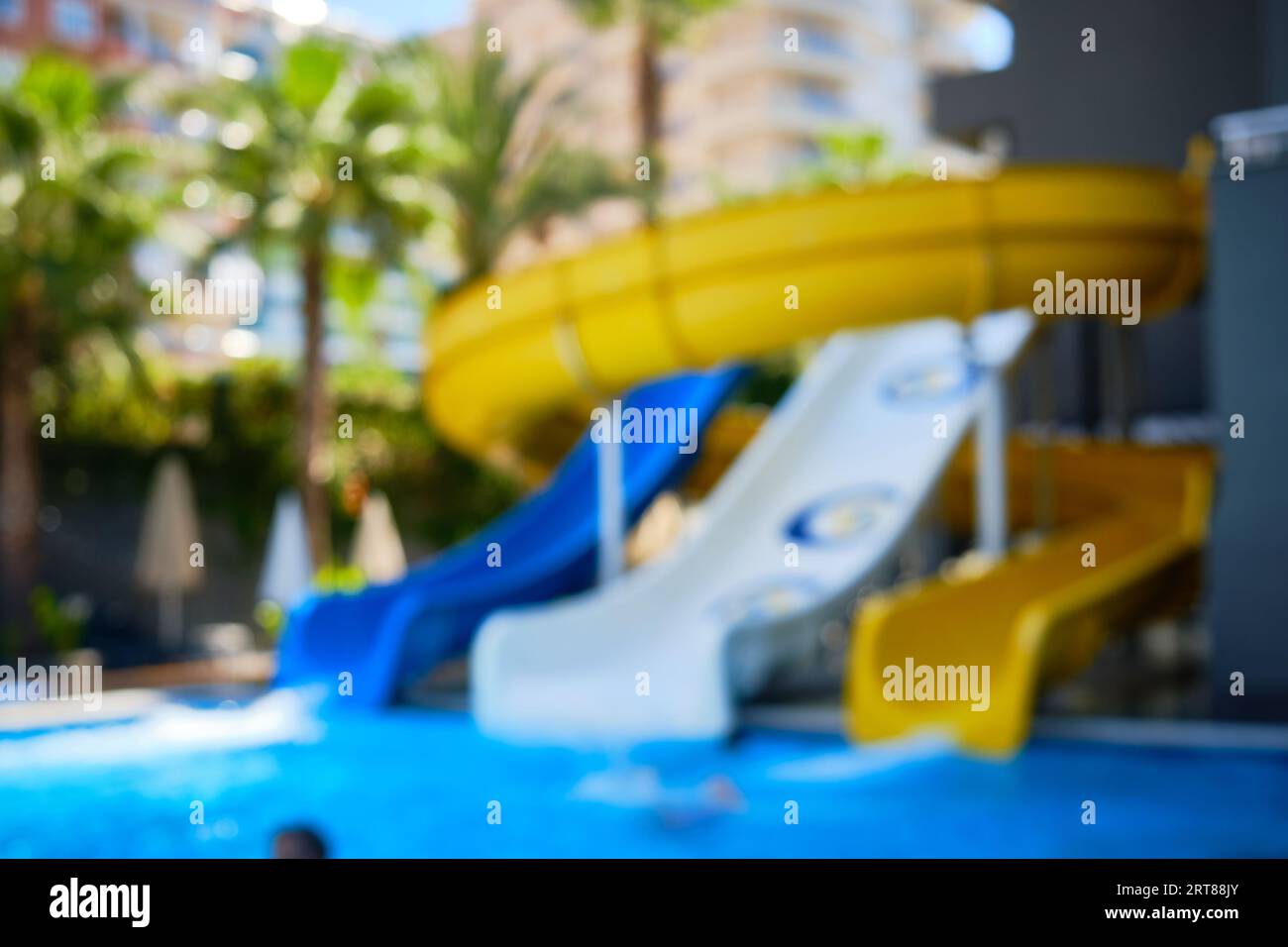 Blurred colorful water slides at water park Stock Photo