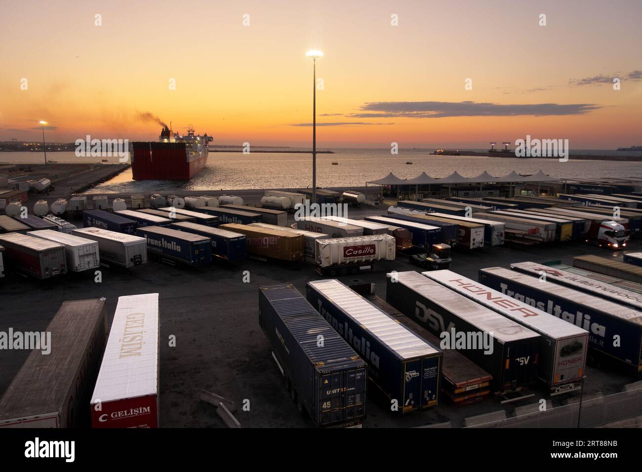 shipping containers in the port of Bari at the sunset, Puglia, Italy Stock Photo