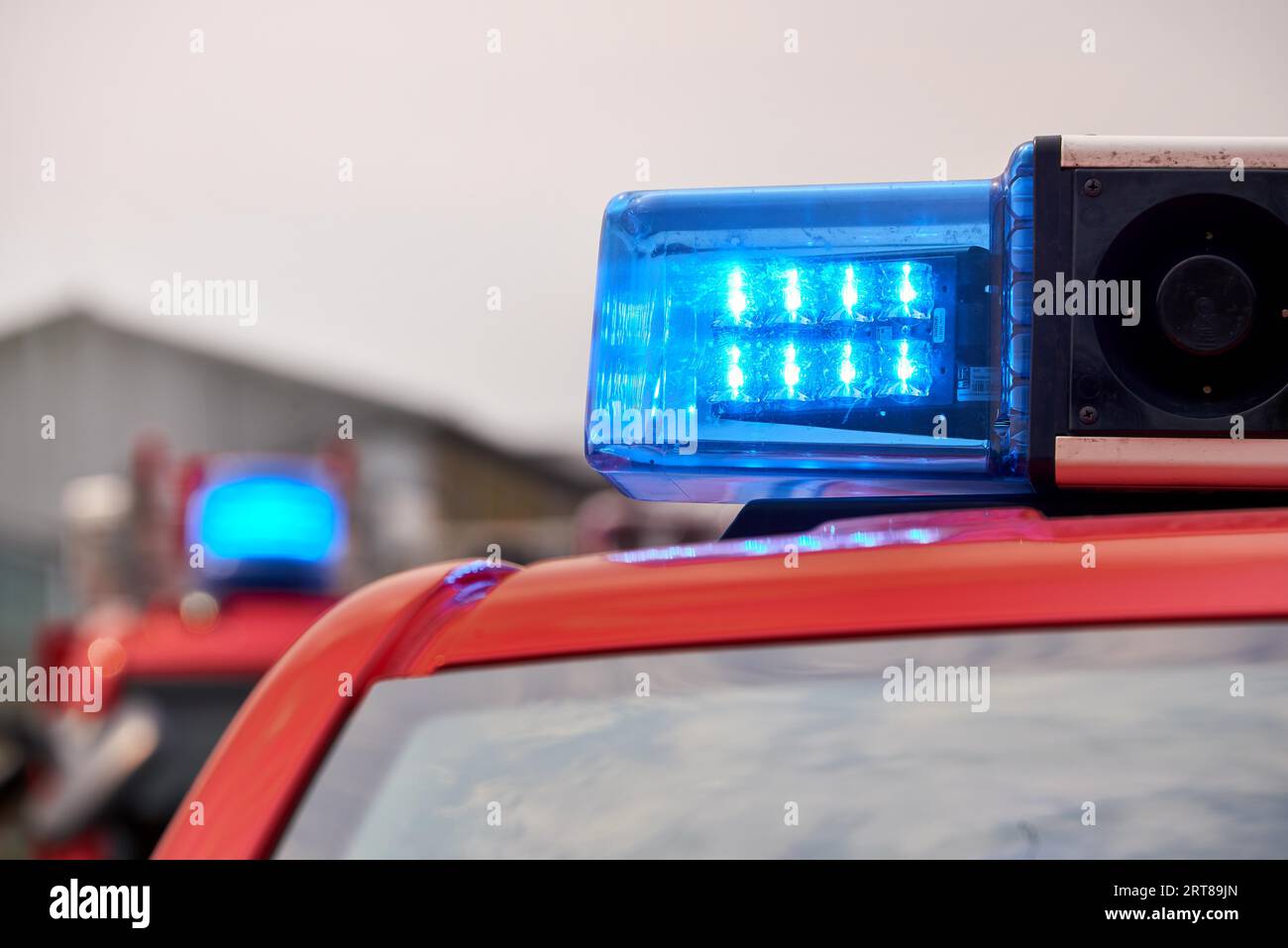 Fire fighter trucks with blue flashing lights Stock Photo Alamy