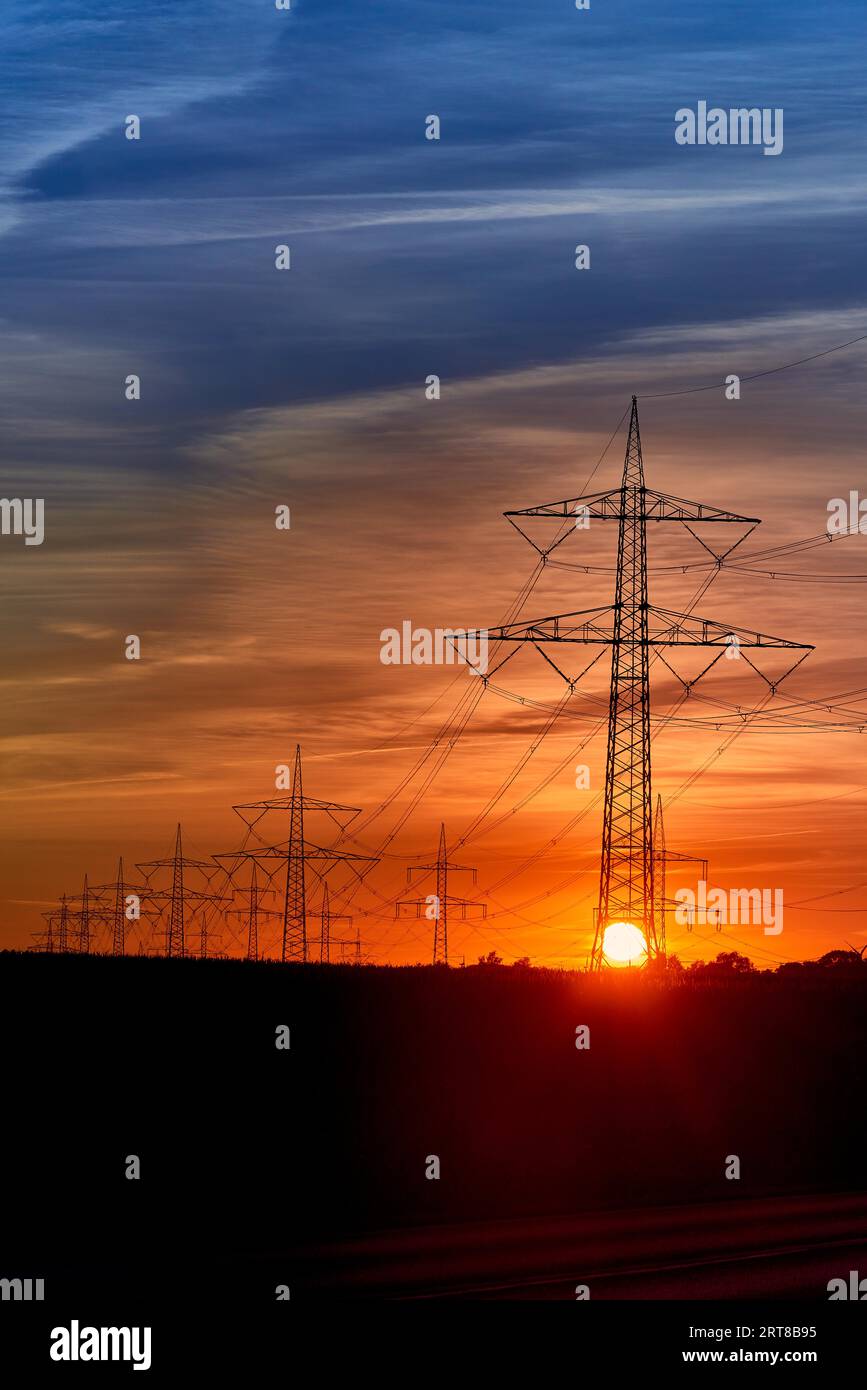 Electricity transportation with hgh voltage wire on pylon Stock Photo