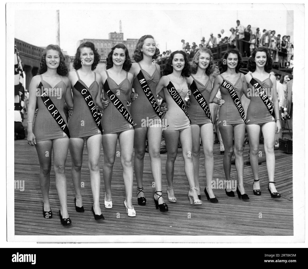 Contestants in a 1940s Miss American contest pose for publicity photographs on the Boardwalk in Atlantic City, New Jersey. Stock Photo