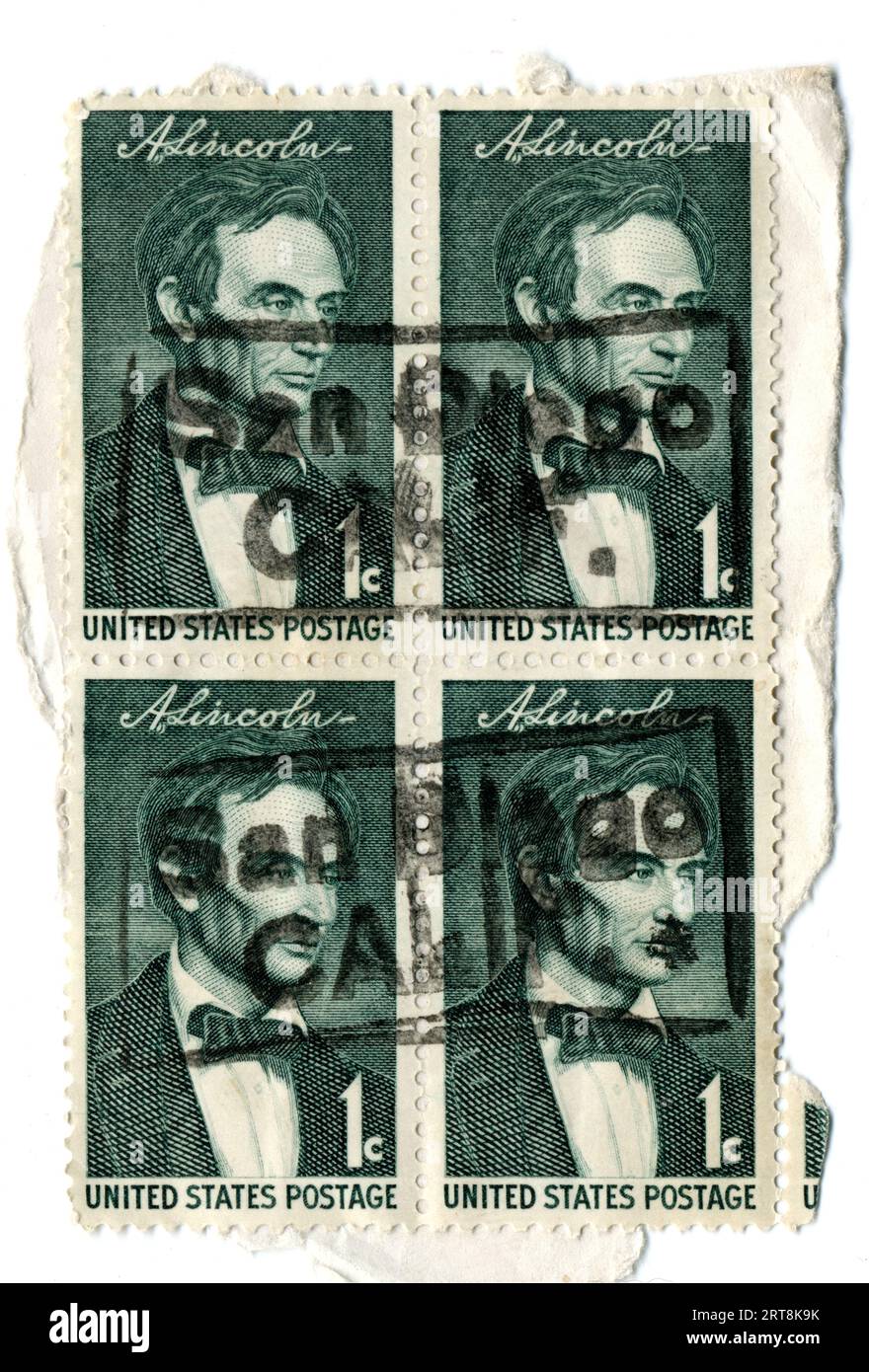 A block of cancelled one-cent U.S. postage stamps honoring former U.S. President Abe Lincoln issued in 1959. Stock Photo