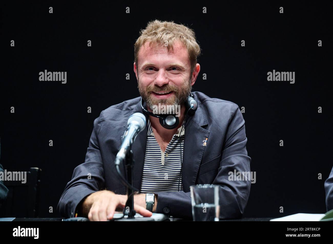 Berlin, Germany. 11th Sep, 2023. Paolo Giordano, Italian writer, sits on stage at the Haus der Berliner Festspiele and talks about his book 'Tasmania'. Giordano's first book, 'The Loneliness of Prime Numbers,' is one of Italy's most successful books. Credit: Annette Riedl/dpa/Alamy Live News Stock Photo