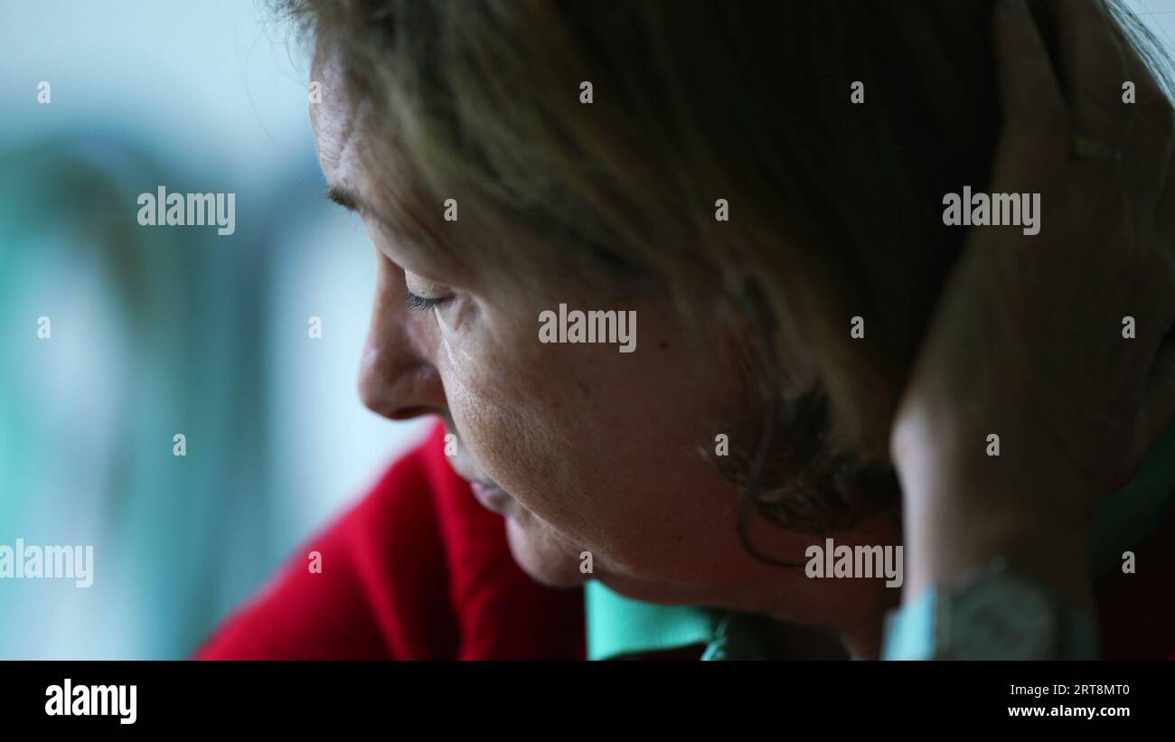 Senior woman pondering solution, closeup face of elderly lady leaning