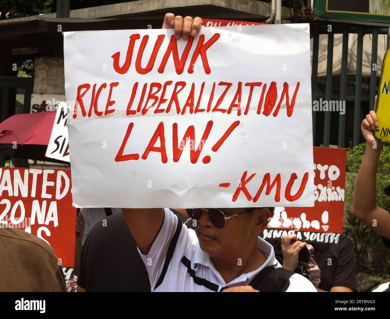 Quezon, Philippines. 11th Sep, 2023. A placard saying junk the rice