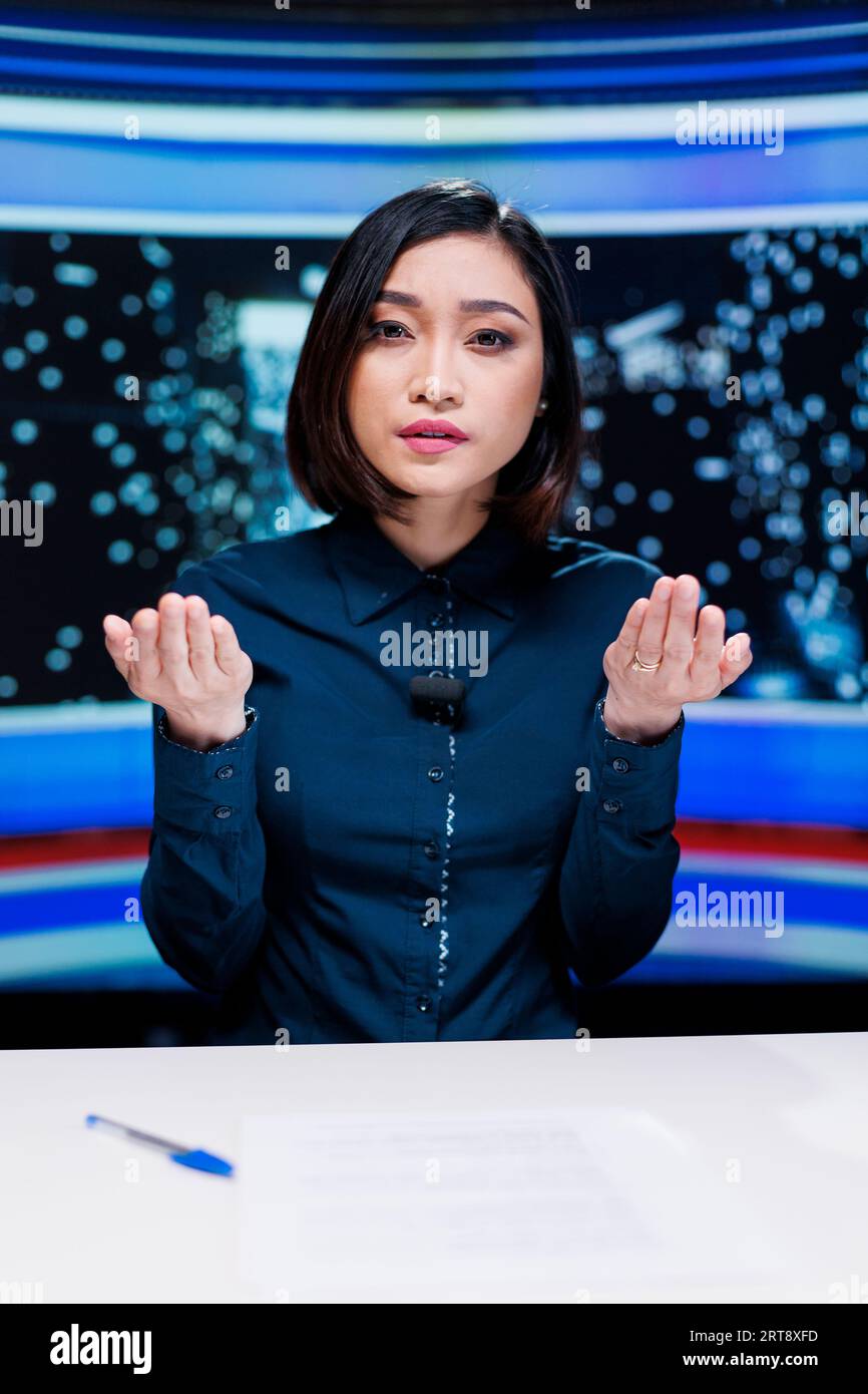 News reporter delivering breaking news on media segment in newsroom,  reading important headlines of the day on international tv program. Man  journalist presenting daily events live Stock Photo - Alamy
