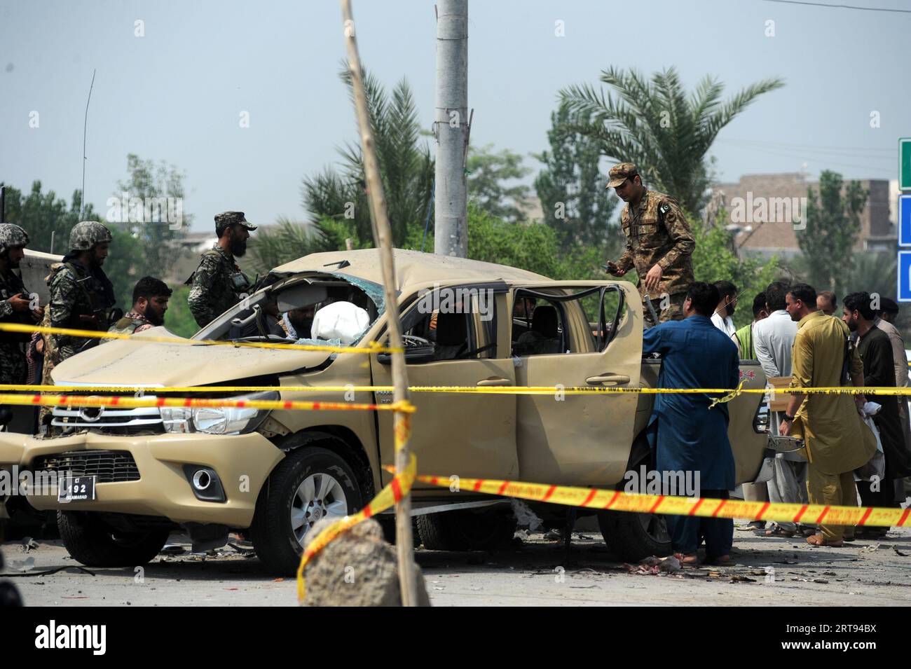 Peshawar, Peshawar, Pakistan. 11th Sep, 2023. Pakistani security officials inspect the scene of an explosion targeting a vehicle of paramilitary frontier corps in Peshawar, Pakistan, 11 September 2023. At least one Frontier Corps official was killed and nine others, including six frontier corps personnel, injured in a blast targeting a security forces vehicle in Peshawar's Warsak road area. The blast is suspected to be an IED explosion, and the nature of the explosion will be confirmed after the Bomb Disposal Unit submits its report, police said. Three civilians were also among the injured Stock Photo