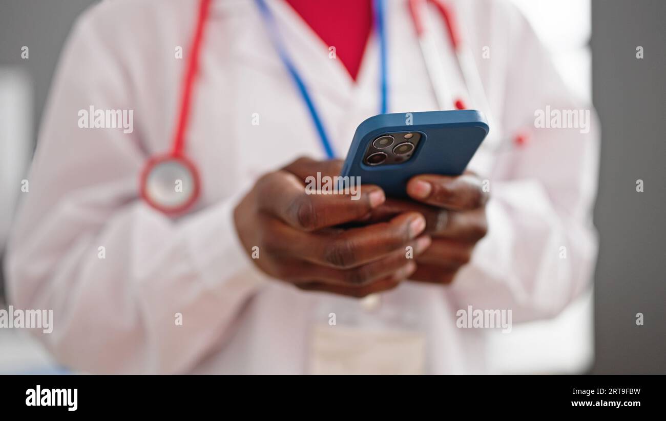 African female doctor typing hi-res stock photography and images - Alamy