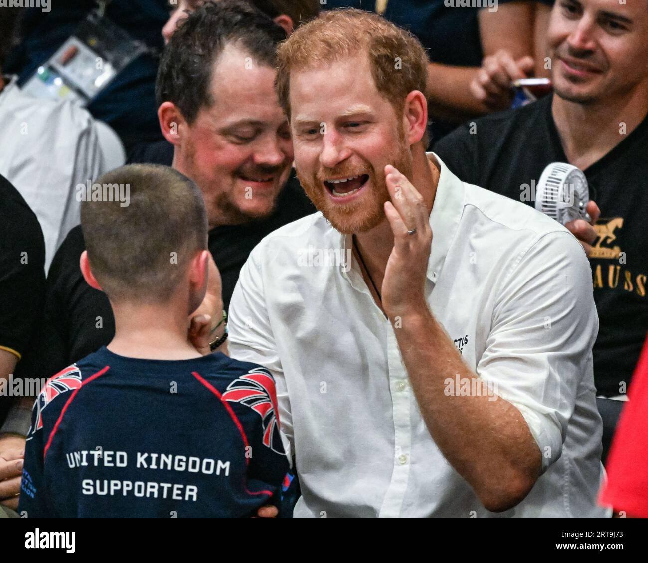 Düsseldorf, Germany. 11th Sep, 2023. The Duke of Sussex, Prince Harry watches the game and interacts with invitees, fans, children and even a UK athlete's sausage dog, before handing Team USA their gold medals after their win. Team United Kingdom play Team USA in the wheelchair rugby finals at the Spiel Merkur arena this evening. Day 2 of the Invictus Games Düsseldorf in and around the Merkur Spiel Arena. Credit: Imageplotter/Alamy Live News Stock Photo