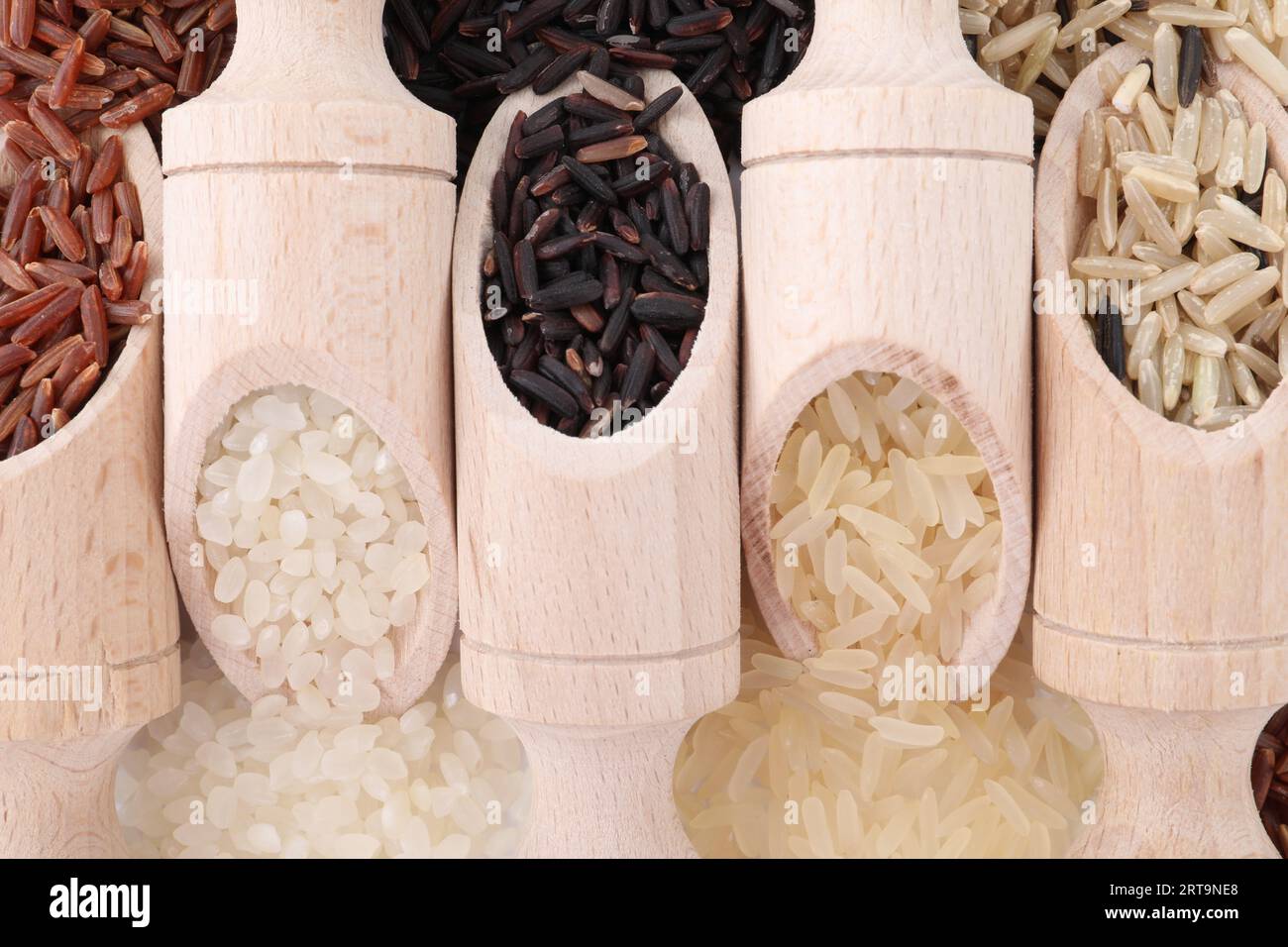 Slops Food Rice Scoops with different sorts of rice as background, top view Stock Photo ...