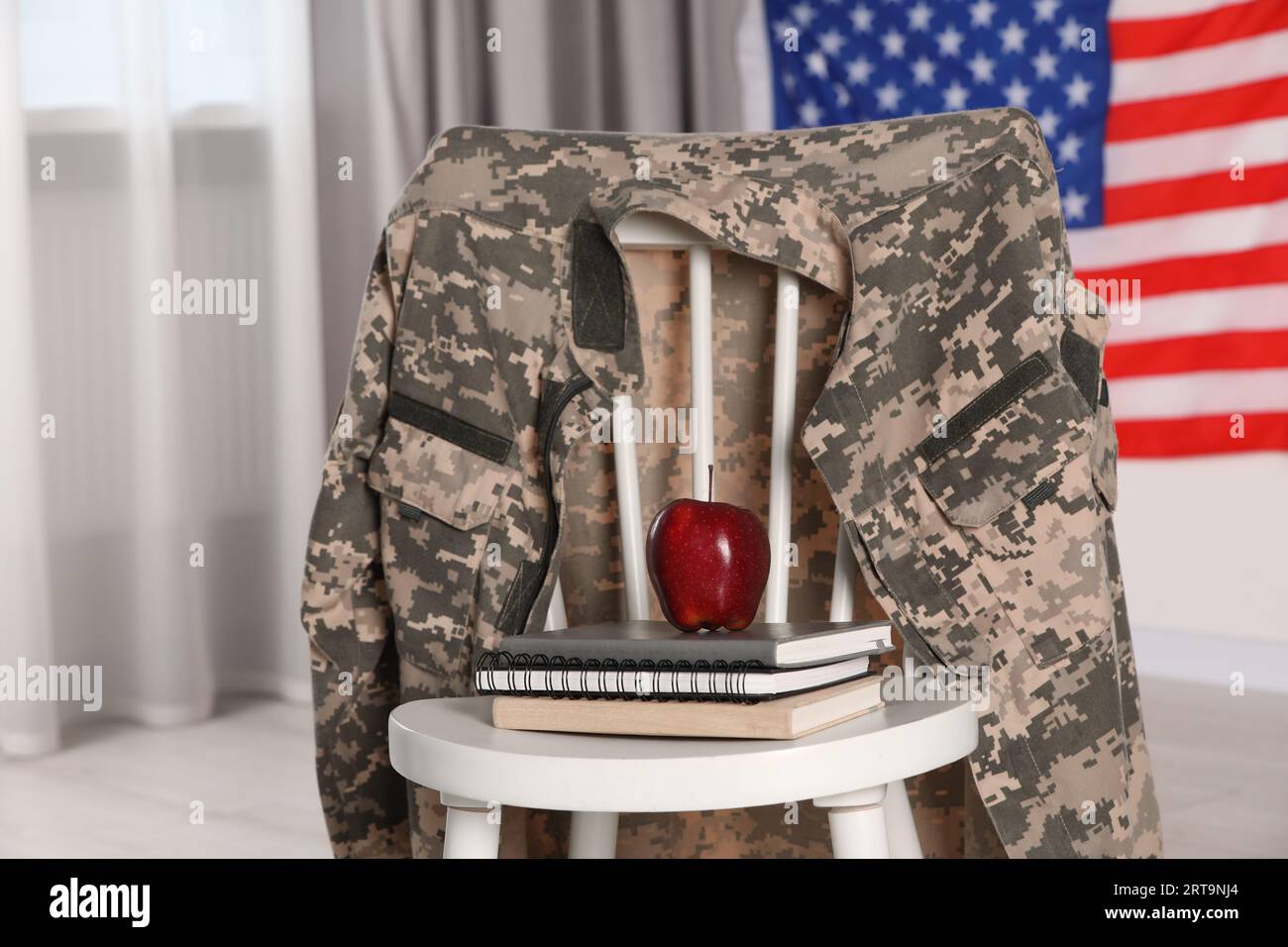 Chair With Soldier Uniform, Notebooks And Apple Near Flag Of United ...